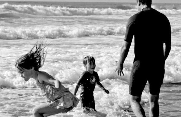 A family having a fun time at the Radhanagar Beach