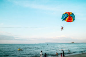 A couple parasailing at Radhanagar Beach