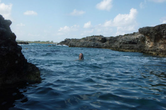 A woman enjoying swimming in the Andaman sea