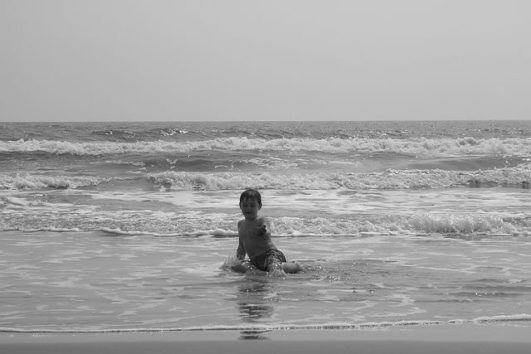 A kid enjoying at Radhanagar Beach