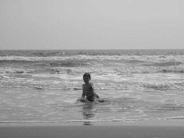 A kid enjoying at Radhanagar Beach