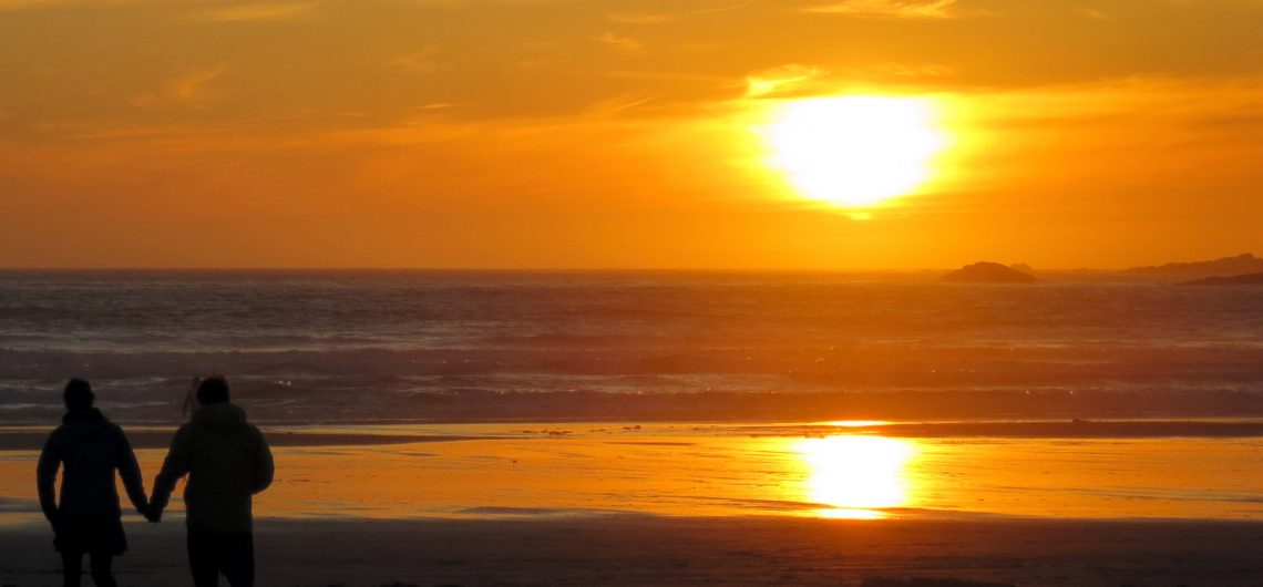 A couple enjoying the sunset at Havelock Beach.