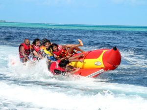 Visitors enjoying a Banana Boat ride in the Andamans
